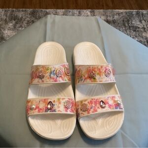 Womens crocs size 10 in white and multi color. Never worn